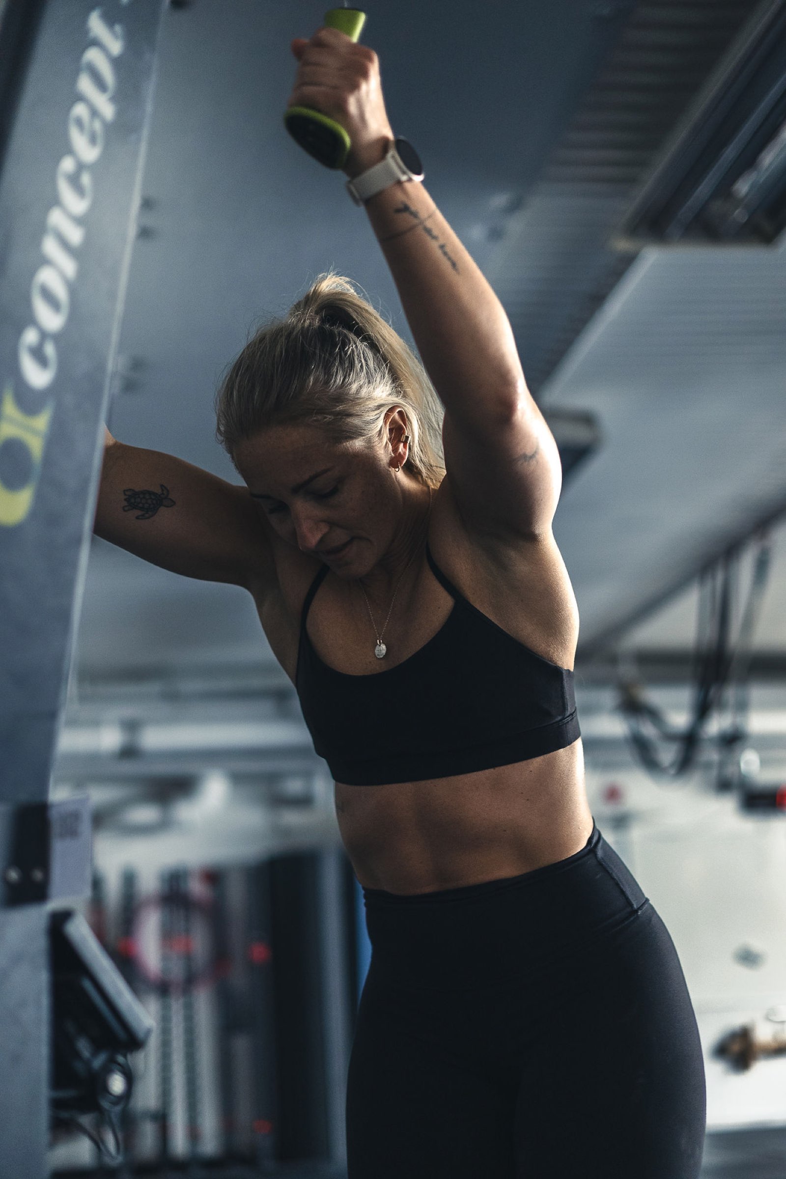 Athlete driving the Concept2 SkiErg handles down, endurance training tracked in Movement Rebels